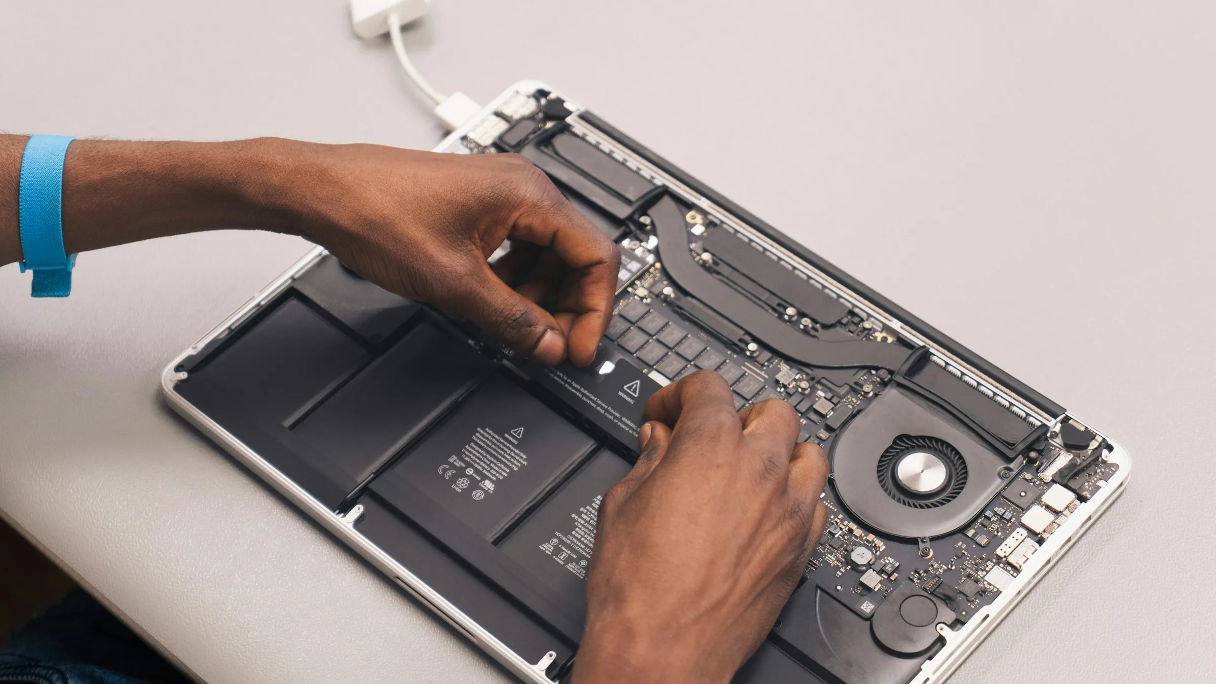 Repair work on a MacBook at develop:IT in South End, Gqeberha